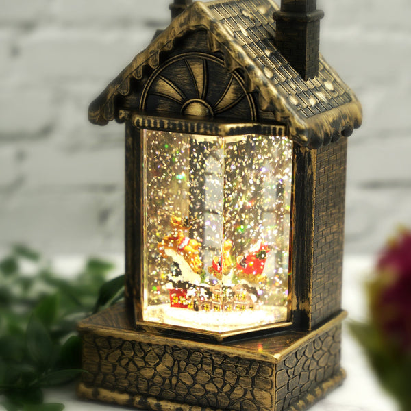 Magical Christmas Snow Globe House with LED Lights and Music, Santa with Reindeer and Gifts - Unique Christmas Decor and Gift for the Holidays by Sona Casa