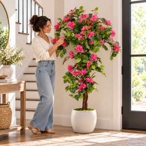 Dark pink artificial bougainvillea tree – decorative white planter beside an entry door
