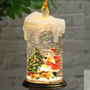 Holiday decorations, beautiful christmas snowglobe candle with lights and music, santa with reindeers by Accent Collection