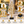 Close-up views of the gold metal frame, clear orb and black base
