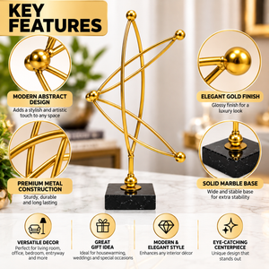 Close-up details of the gold-tone metal sculpture and black base